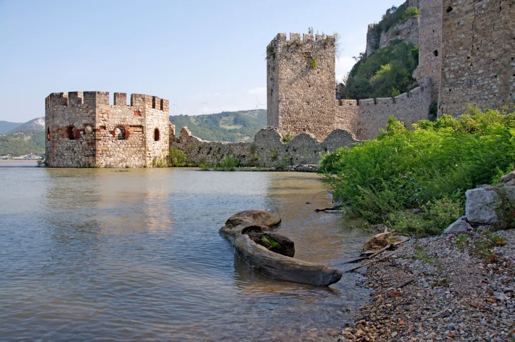 Golubac Fortress at the entrance to the Iron Gates with a boat on the Danube