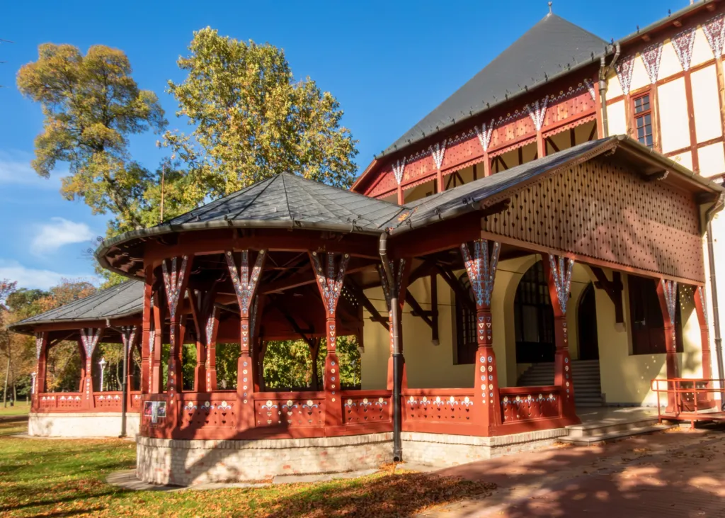 The carved timber Great Terrace pavilion on the shore of Palić Lake