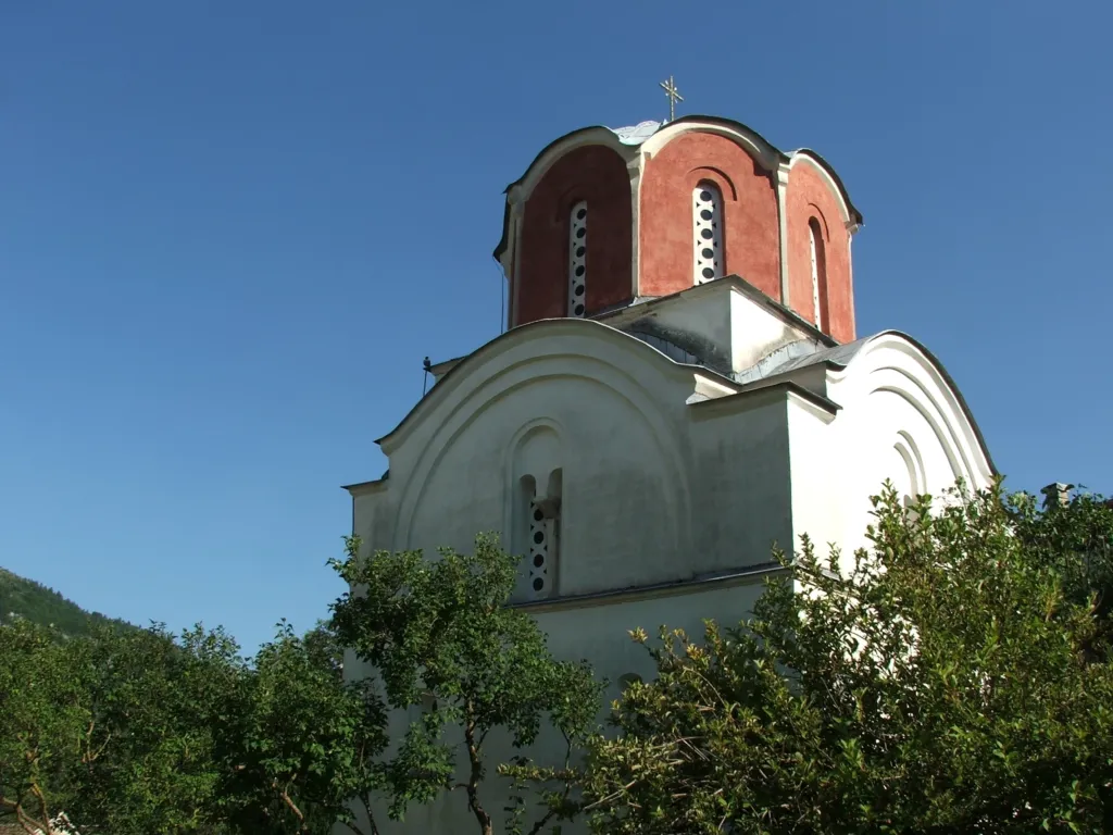 The small domed King’s Church of Studenica Monastery against a blue sky