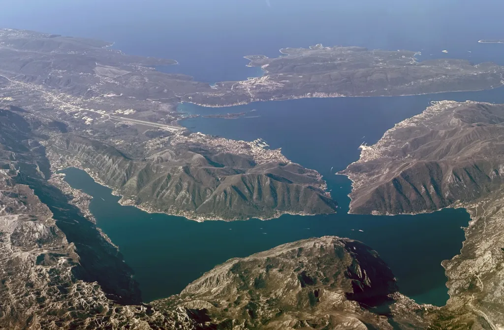 Aerial view of the Bay of Kotor, its narrow straits and mountains rising from the water, Montenegro