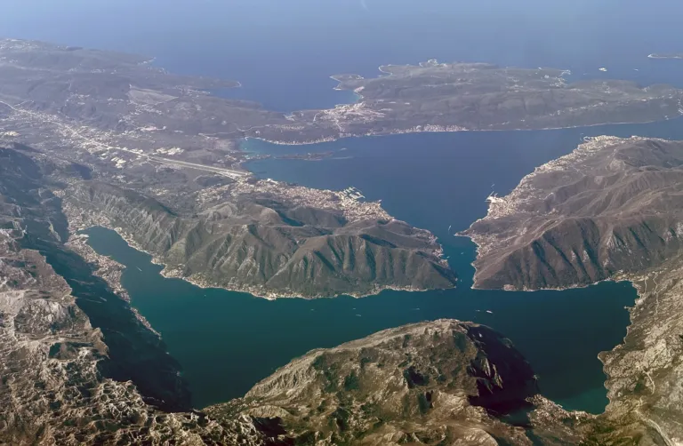 Aerial view of the Bay of Kotor, its narrow straits and mountains rising from the water, Montenegro