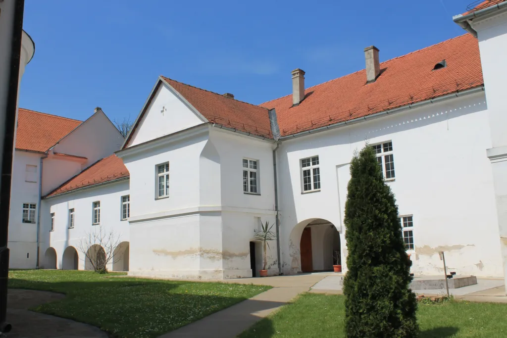 The white walls and church of Krušedol Monastery on Fruška Gora