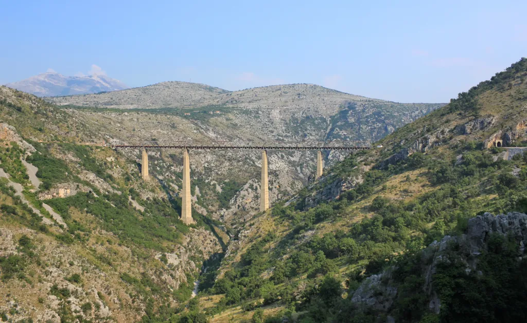 The tall Mala Rijeka railway viaduct spanning a green mountain gorge in Montenegro