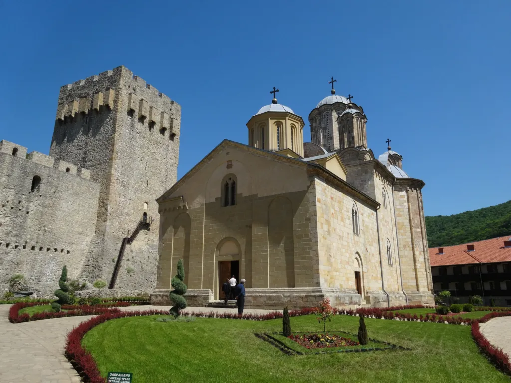 The Church of the Holy Trinity at Manasija Monastery beside a fortress tower
