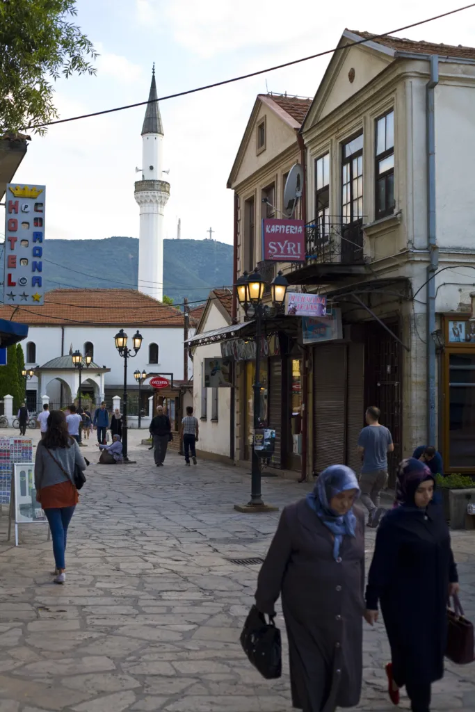 A street of the Old Bazaar in Skopje with shops and a mosque