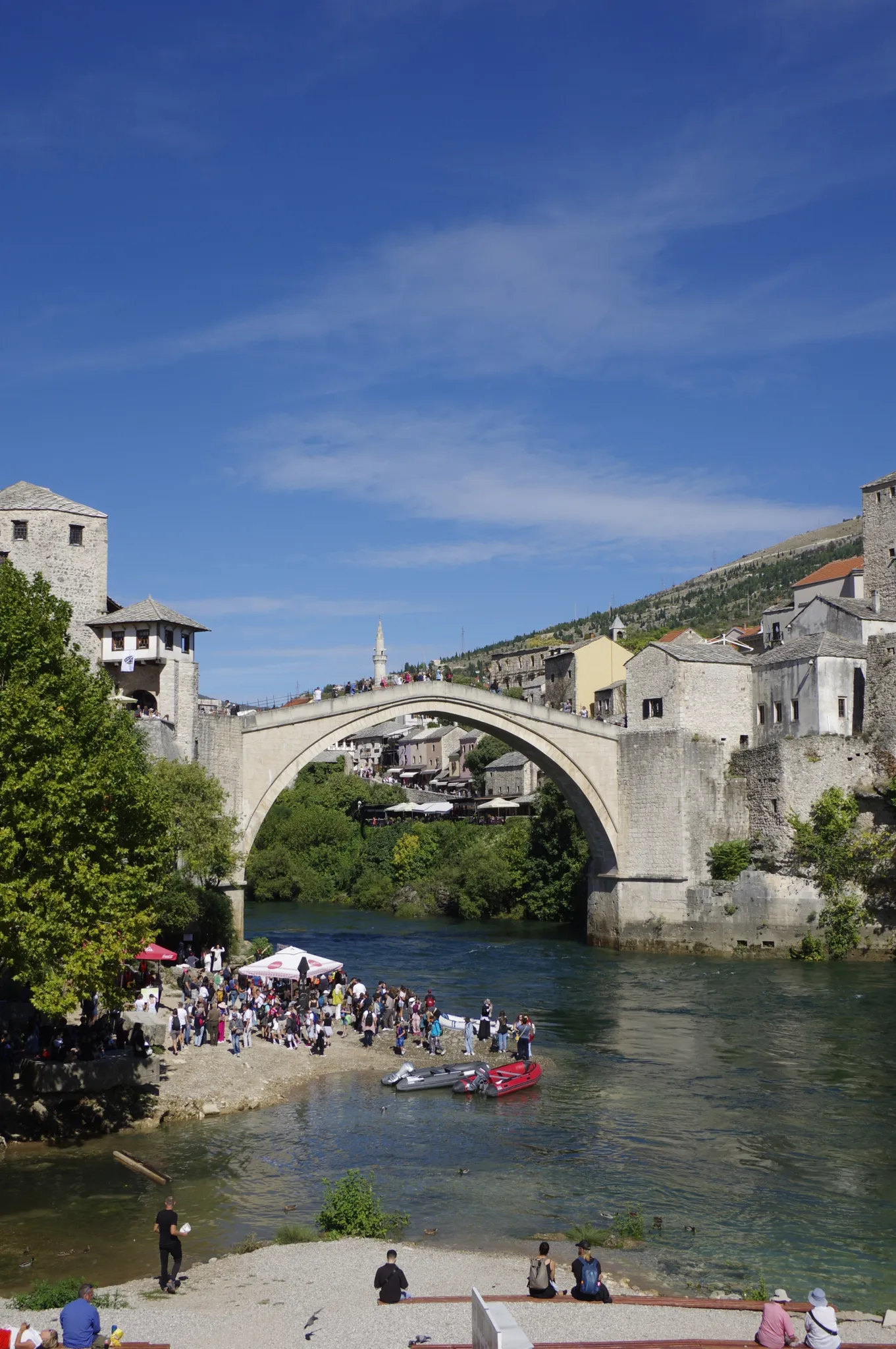 The arched Old Bridge over the Neretva between the stone towers of Mostar