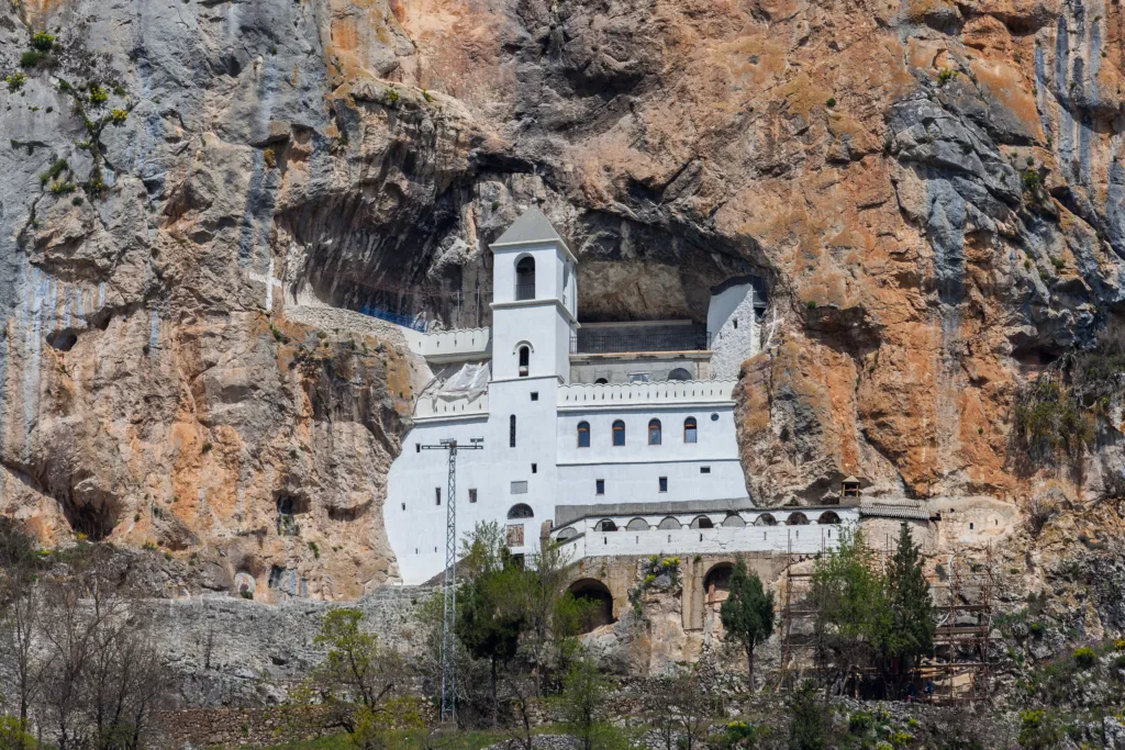 The white upper monastery of Ostrog built into a vertical rock face