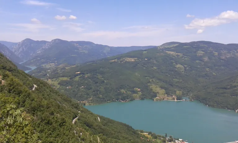 Perućac Lake filling the Drina canyon between forested mountains