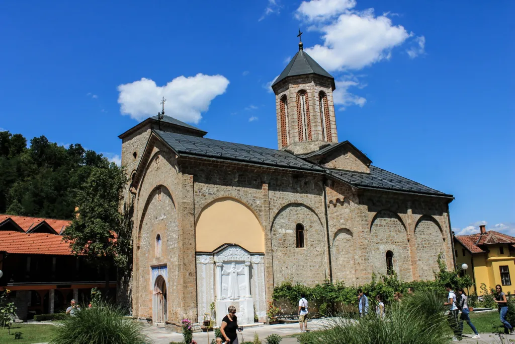 The stone church of Rača Monastery under a blue sky near Bajina Bašta