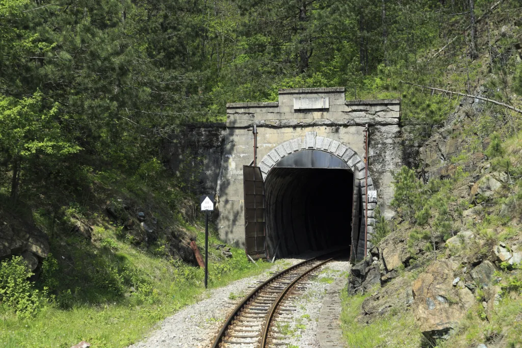A stone tunnel portal on the narrow-gauge Šargan Eight line in the Mokra Gora forest