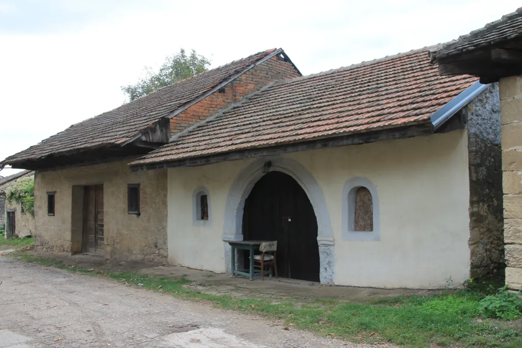A stone wine cellar with a tiled roof in the Rajac wine cellars