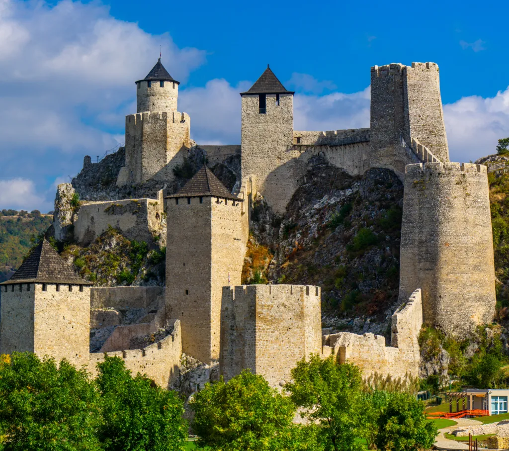 The towers and walls of Golubac Fortress rising above the Danube on a sunny afternoon