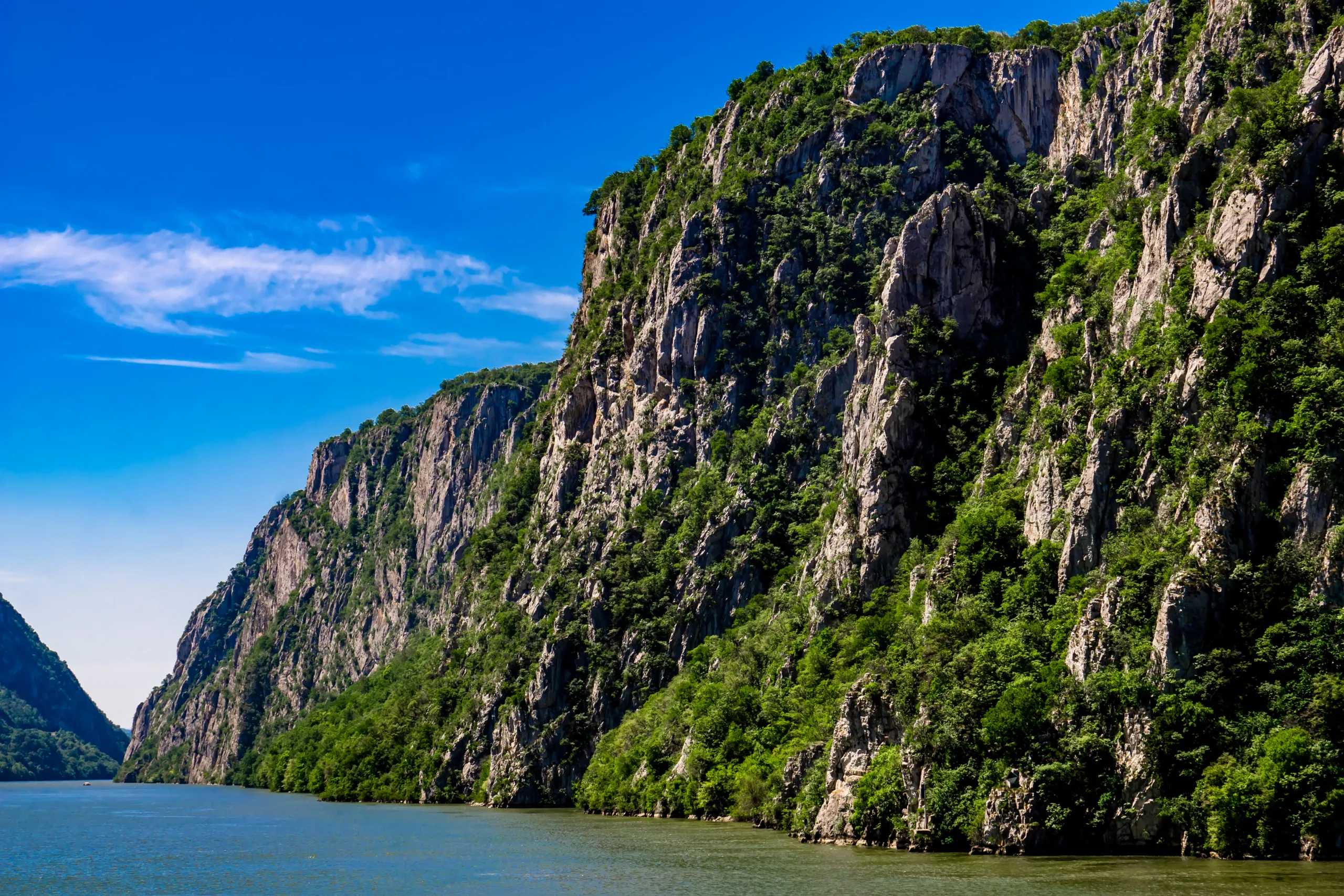Limestone cliffs of the Đerdap gorge rising above the Danube at the Iron Gates