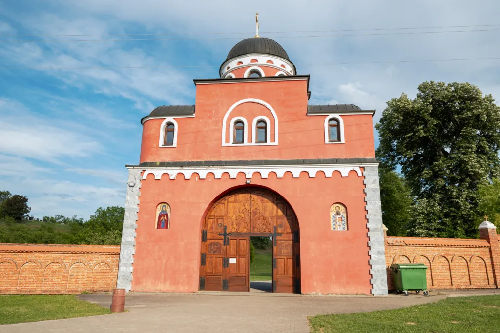 The red gate tower of Krušedol Monastery in Fruška Gora