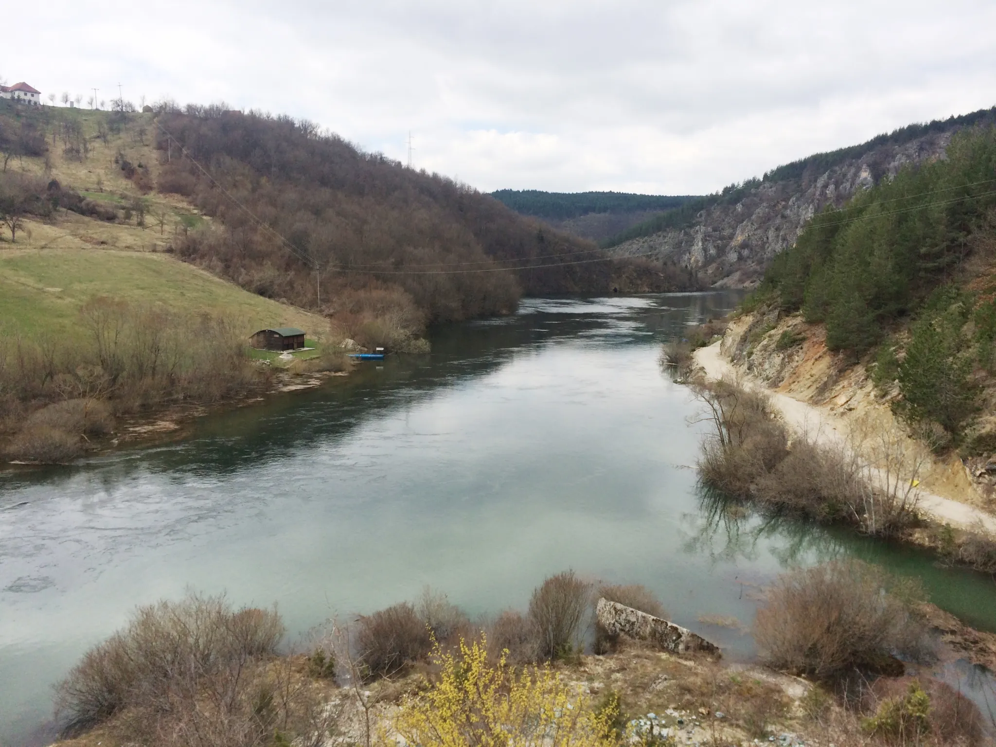 The calm Uvac river between grassy hills at Kokin Brod near Nova Varoš