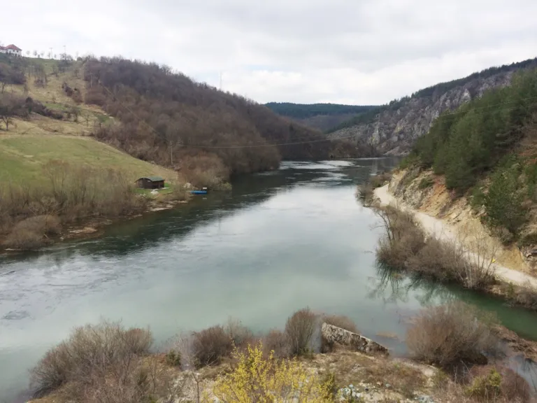 The calm Uvac river between grassy hills at Kokin Brod near Nova Varoš