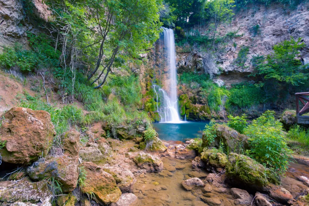 The tall Veliki Buk waterfall in its rocky gorge at Lisine