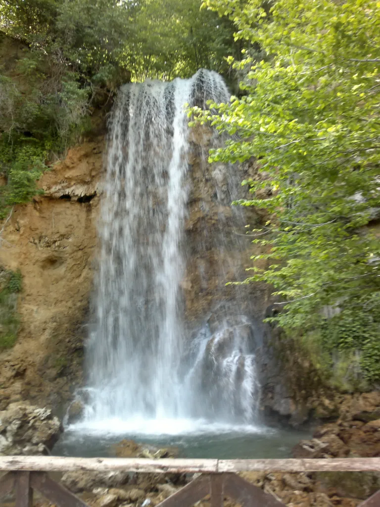 The Veliki Buk waterfall falling down a mossy cliff at Lisine