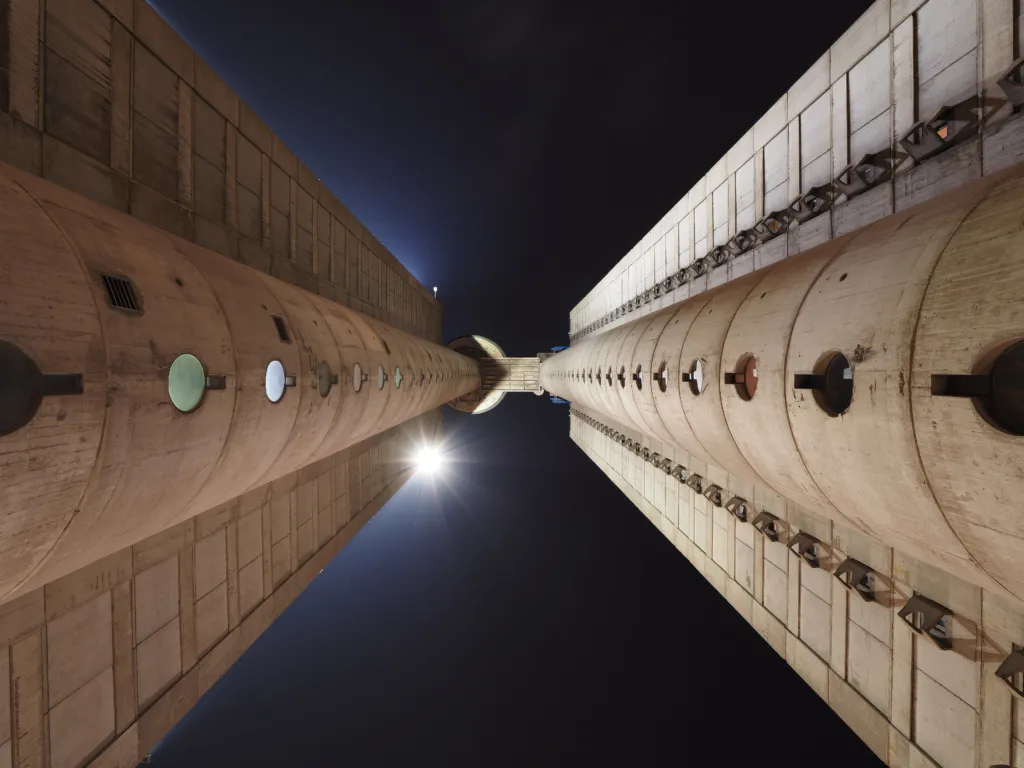 Looking up between the two concrete towers of the Western City Gate in New Belgrade